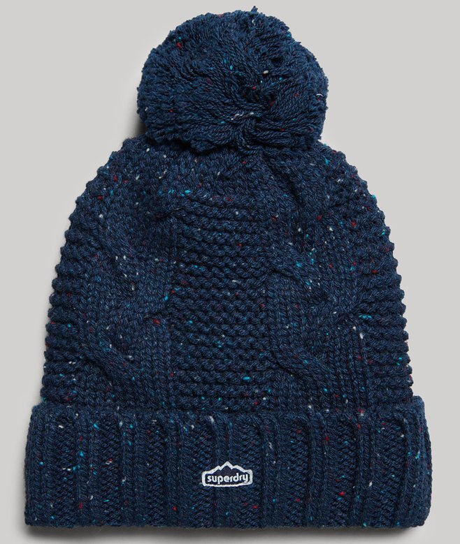 Bobble-mössa i stickat mönster Bobble-mössa i stickat mönster