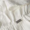 Broderad midiklänning med volanger Broderad midiklänning med volanger