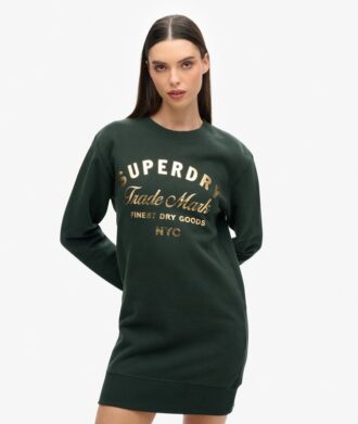 Jerseyklänning med lyxigt metalliskt logo