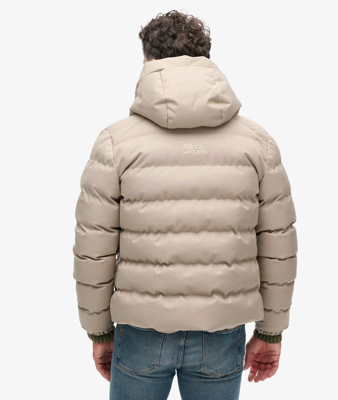 Tweed-sportjacka med huva som puffar Tweed-sportjacka med huva som puffar